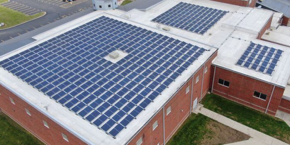 A large solar array on a school rooftop