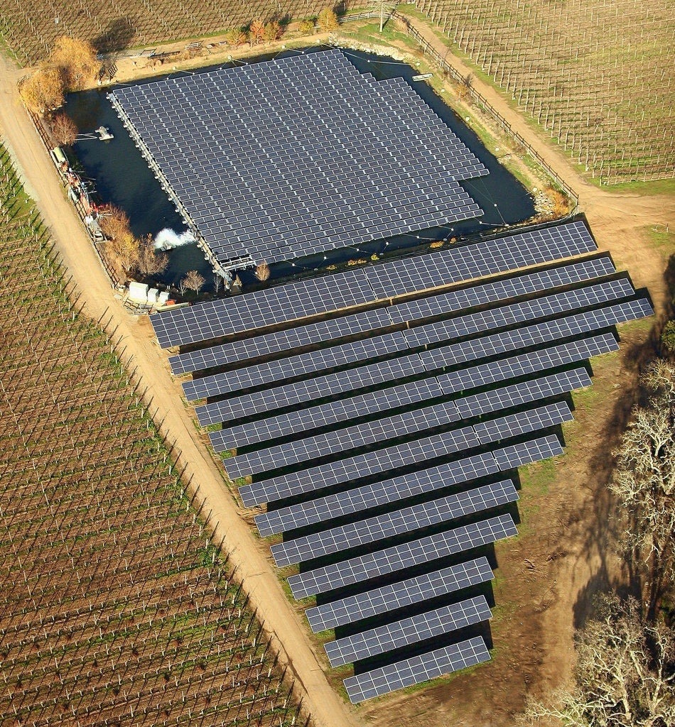 floating solar panel array on a pond in a rural area