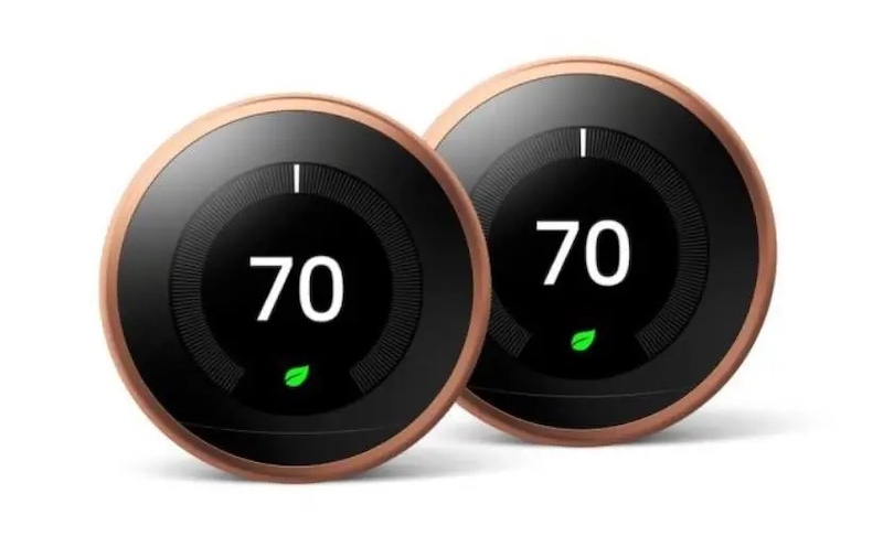 Photo of two Nest Learning Thermostats on a white background