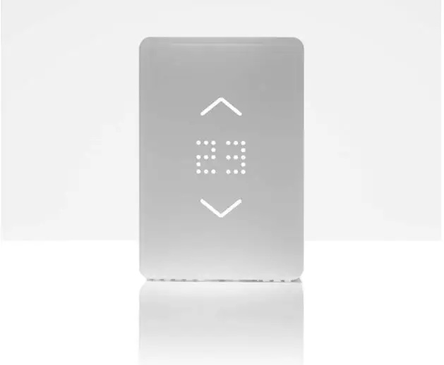 photo of the Mysa Smart Thermostat on a white table