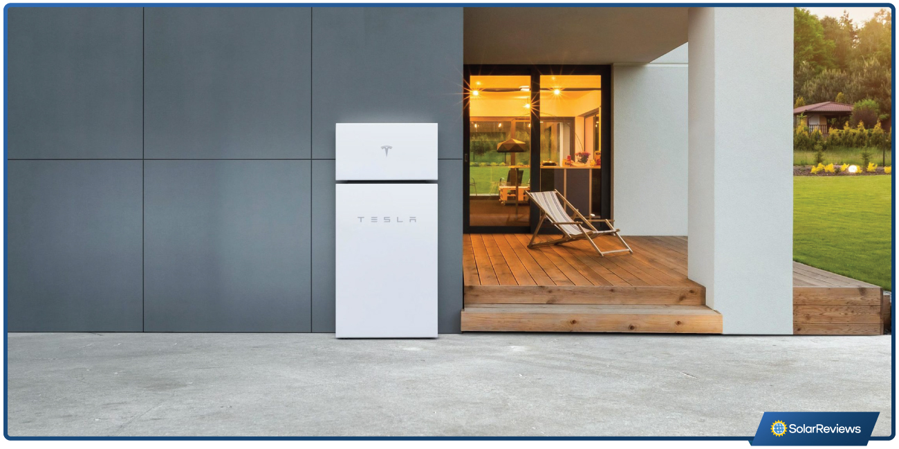 Tesla Powerwall setup mounted on the side of a house