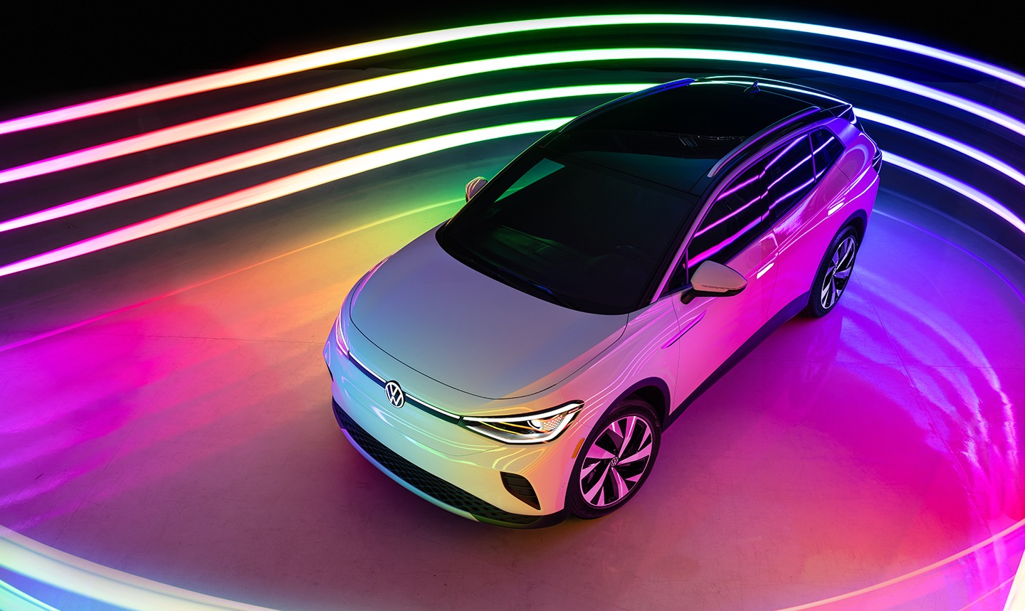 A Volkswagen ID.4 surrounded by rainbow LED lights